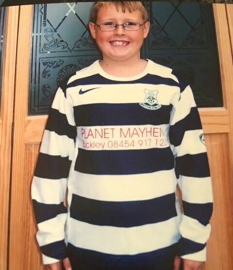Jordan as a boy in his football shirt